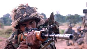 a soldier is holding an ak - 47 rifle indian army wallpaper