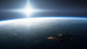 A space satellite hovering over the surface of Earth 1440p wallpaper
