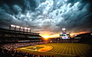 A stunning view of a baseball stadium at sunset baseball wallpaper