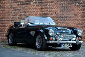 A stylish Black British Sports Car on a sunny Sunday. car wallpaper