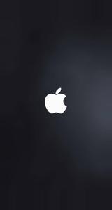 A vivid white Apple logo on a dark gray background  Wallpaper