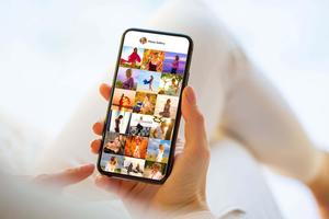 a woman holding a phone with pictures on it instagram wallpaper