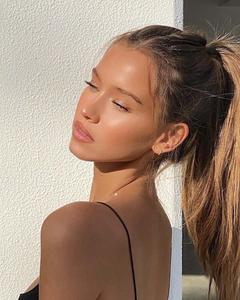 a woman in a black top and ponytail aesthetic girl wallpaper