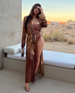 a woman in a brown bodysuit posing in the desert mia khalifa wallpaper