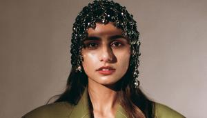 a woman in a green jacket with a headband mia khalifa wallpaper