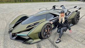 a woman is posing next to a green car lamborghini wallpaper