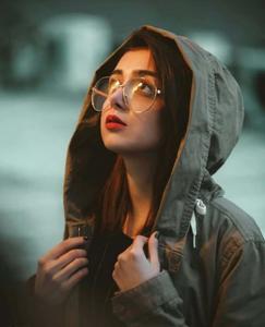 a woman wearing glasses and a hoodie girl wallpaper