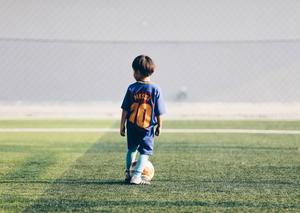A young hopeful looks forward to one day wearing Lionel Messi's jersey. football wallpaper