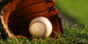 A young runner darts for home plate in an all-out sprint baseball wallpaper