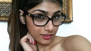 a young woman in glasses posing for a photo mia khalifa wallpaper