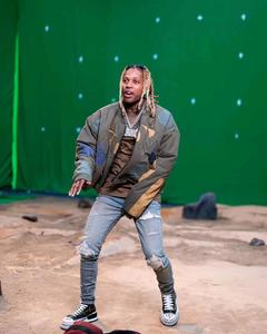 American Rapper Lil Durk Posing in a Dark Room lil durk wallpaper