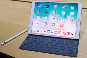 an apple ipad pro with a keyboard and pen ipad wallpaper