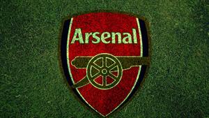 Arsenal Logo On Grass Field arsenal wallpaper