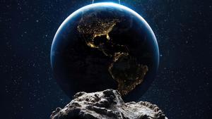 Asteroid Near Bright Earth Background earth wallpaper