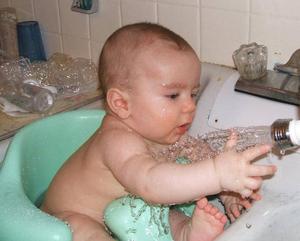 Baby Boy Playing With Water baby boy wallpaper