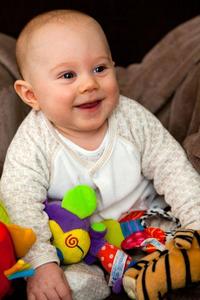 Baby Boy Smiling With Toys baby boy wallpaper