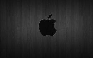 Black Apple Logo on Dark Wood Wallpaper