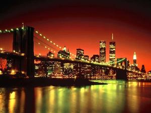brooklyn bridge at night with lights on new york city wallpaper