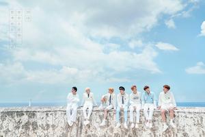 BTS enjoying a sunny day under a beautiful blue sky Wallpaper