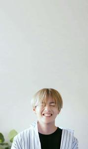 BTS V Stands Out Against An Urban Skyline bts v wallpaper