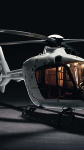  Caption: A Maverick Civil Helicopter in Flight  Wallpaper