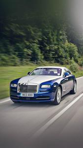 Opulence on Wheels - A Stunning Blue and White Rolls Royce rolls royce wallpaper
