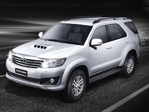  Caption: Silver 2012 Toyota Fortuner Parked on a Scenic Roadway 