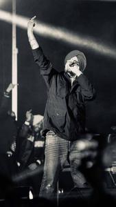 Captivating Snapshot of Sidhu Moose Wala Energizing the Audience Wallpaper