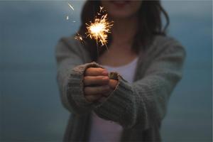 Celebrating a Special Occasion with a Sparkler girl wallpaper