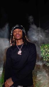 Chilling Portrait of King Von with an Intense Gaze king von wallpaper