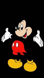Classic Mickey Mouse Smiling Happily Against a Sky Blue Background. mickey mouse wallpaper