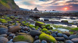 Cool stones on the beach for a perfect day 8k wallpaper