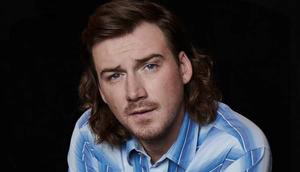 Country singer Morgan Wallen performing onstage. morgan wallen wallpaper