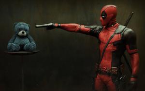 Deadpool Pointing His Gun At Teddy deadpool wallpaper