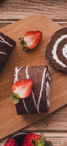 Delectable Chocolate Cake Roll displayed on an iPhone 13 Pro iphone 13 pro wallpaper