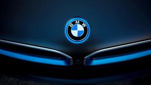 Elegant BMW vehicle parked outside a modern home 4k bmw wallpaper