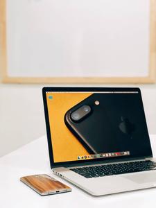 Elegant MacBook Pro on a White Surface macbook pro wallpaper