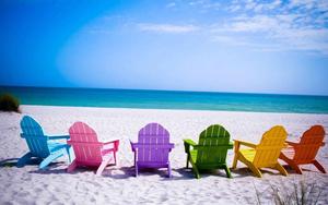 Enjoy the breathtaking view from colorful beach chairs beach wallpaper