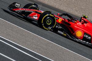 ferrari f1 car driving on a track f1 wallpaper