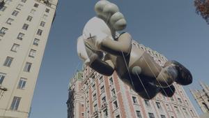 Floating KAWS Passing Through kaws wallpaper