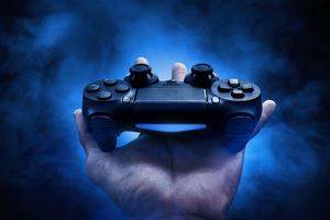 Gaming Controller On Hand Wallpaper