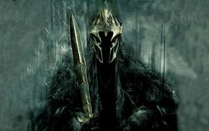 Gandalf the Grey wielding a powerful staff in The Lord of the Rings lord of the rings wallpaper