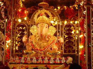 ganesh idol in a temple with lights ganesh wallpaper