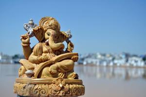 ganesh statue in front of a lake ganesh wallpaper