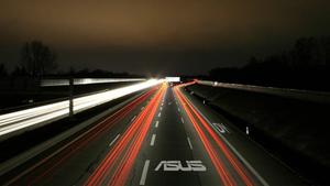 Glowing Lights Illuminate The City's Streets asus wallpaper