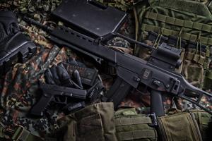 Guns And Vest gun wallpaper