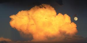 Half-Lit Moon Rising Above Dark Clouds moon wallpaper