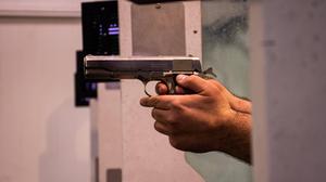 Hands Holding Gun gun wallpaper