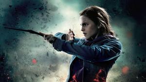 Hermione Granger using her wand to cast a spell harry potter wallpaper