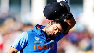 Indian cricket star Virat Kohli in action during a match. Wallpaper